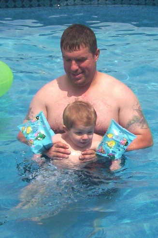 Magnus swimming with Daddy